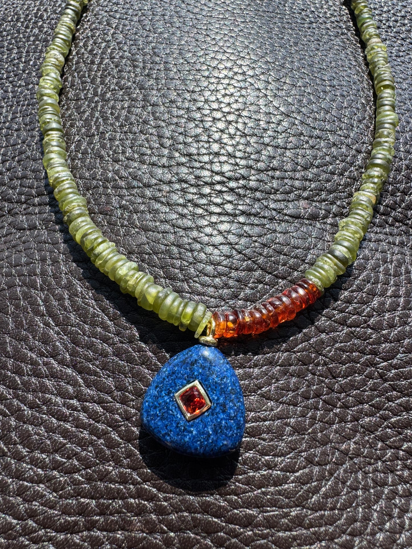 Color block with navy blue charm pendant