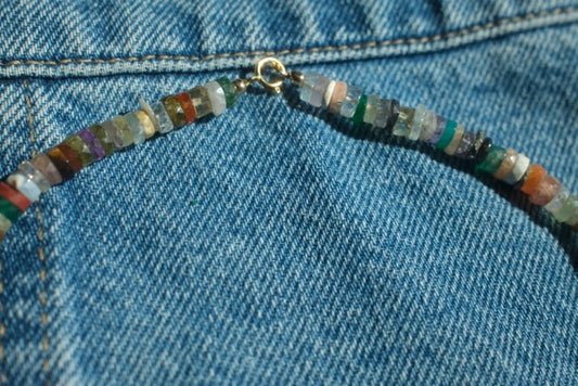Beaded necklace on a denim background