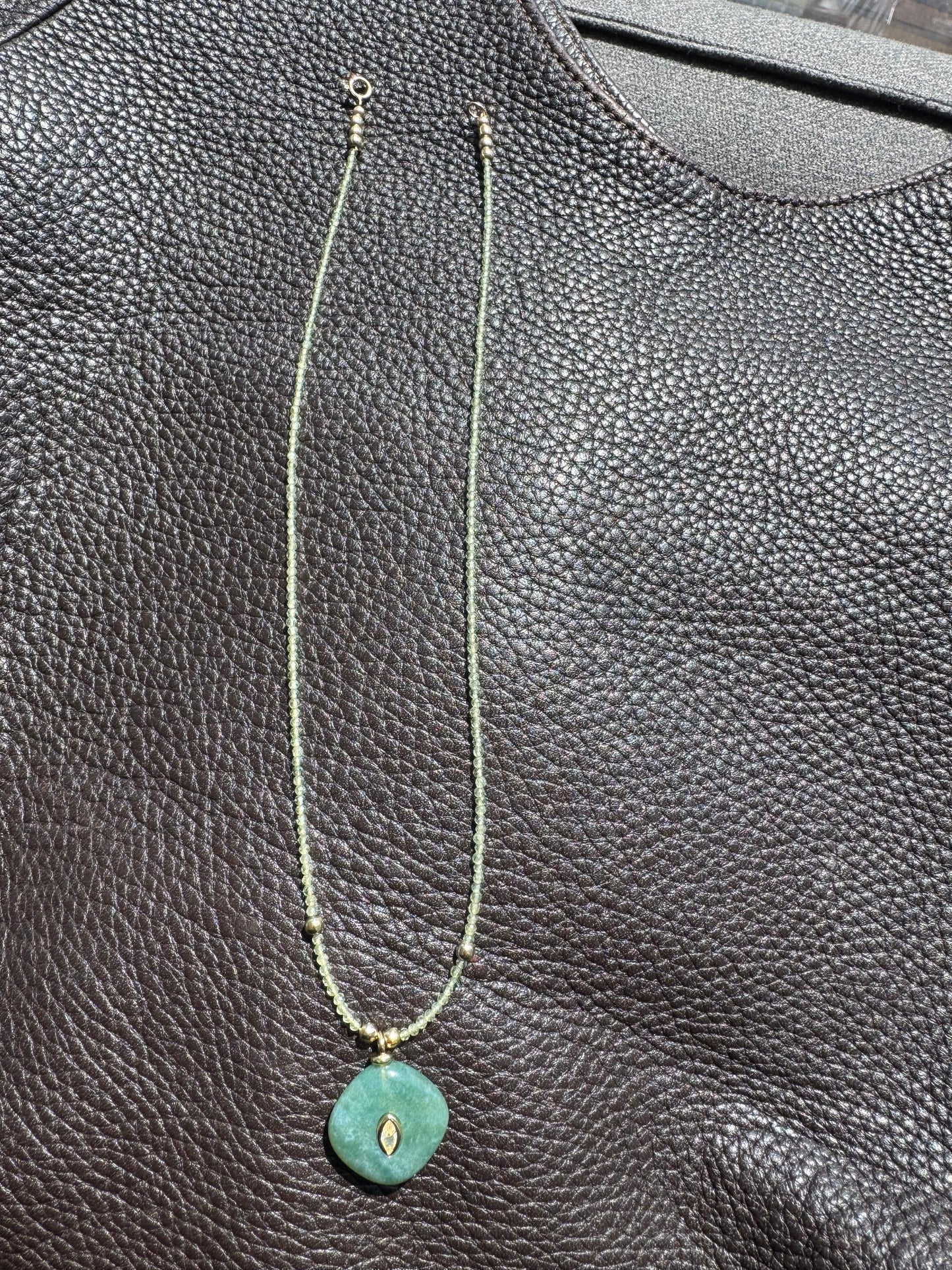 Green quartz gemstone with earthy charm pendant