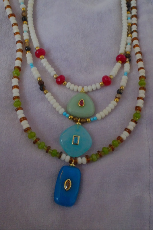 Mixed/white beads with blue charm pendant