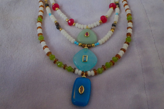 Mixed/white beads with blue charm pendant
