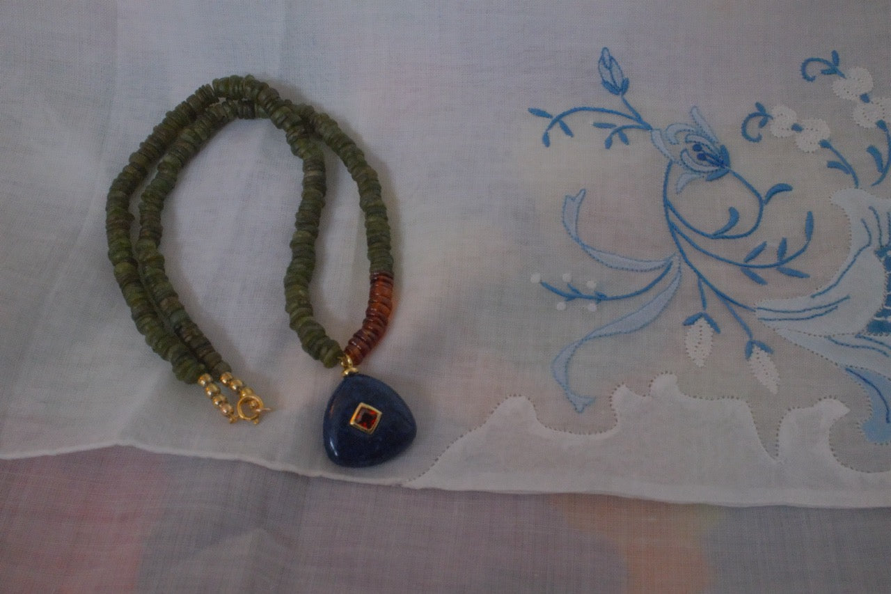 Color block with navy blue charm pendant