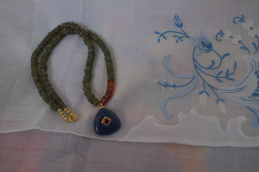 Color block with navy blue charm pendant
