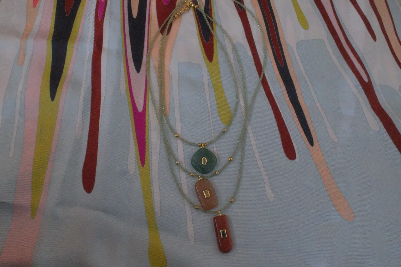 Green quartz gemstone with earthy charm pendant